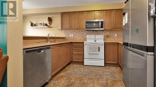 100 - 16 Bellhaven Crescent, Brampton, ON - Indoor Photo Showing Kitchen With Double Sink