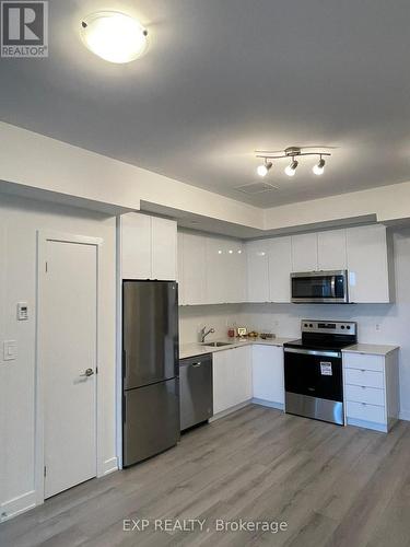 609 - 1440 Clarriage Crt Court, Milton, ON - Indoor Photo Showing Kitchen With Stainless Steel Kitchen