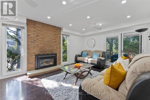 15 Shadberry Drive, Toronto, ON - Indoor Photo Showing Living Room With Fireplace