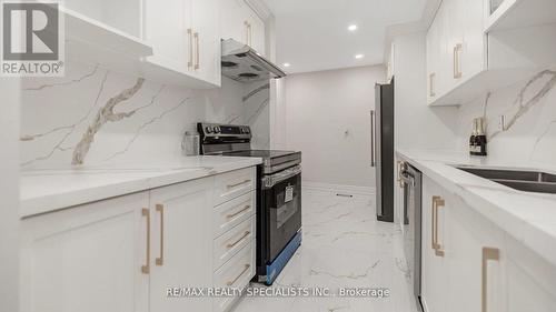 65 - 1 Gloucester Place, Brampton, ON - Indoor Photo Showing Kitchen With Double Sink