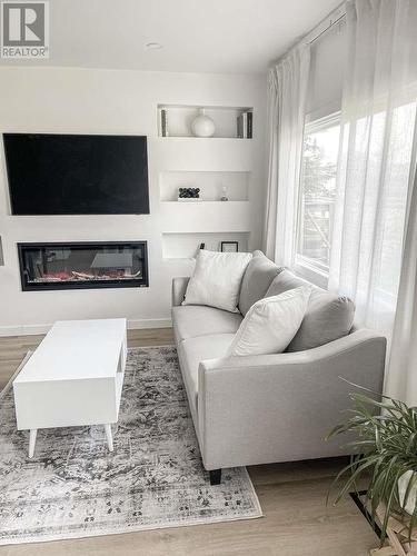 9619 99 Avenue, Fort St. John, BC - Indoor Photo Showing Living Room With Fireplace