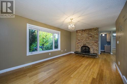 3191 2Nd Avenue, Prince George, BC - Indoor Photo Showing Living Room With Fireplace