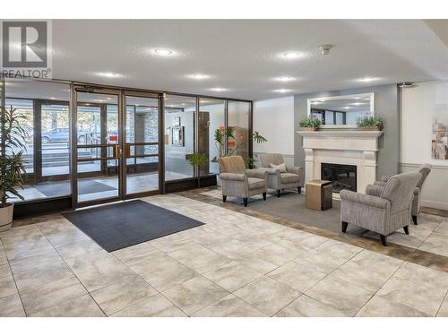 737 Leon Avenue Unit# 505, Kelowna, BC - Indoor Photo Showing Other Room With Fireplace