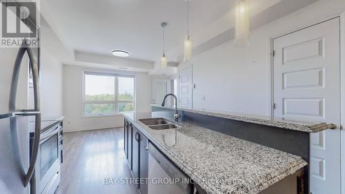 512 - 2 Adam Sellers Street, Markham, ON - Indoor Photo Showing Kitchen With Double Sink With Upgraded Kitchen