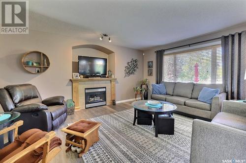 1142 Degelman Drive, Regina, SK - Indoor Photo Showing Living Room With Fireplace