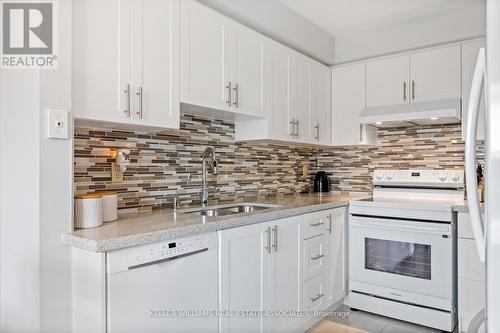 23 - 5230 Glen Erin Drive, Mississauga, ON - Indoor Photo Showing Kitchen With Double Sink