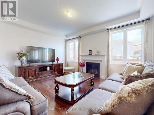 84 Robert Parkinson Drive, Brampton, ON - Indoor Photo Showing Living Room With Fireplace