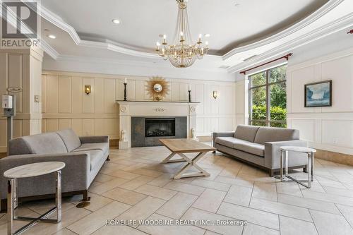 2718 - 700 Humberwood Boulevard, Toronto, ON - Indoor Photo Showing Living Room With Fireplace