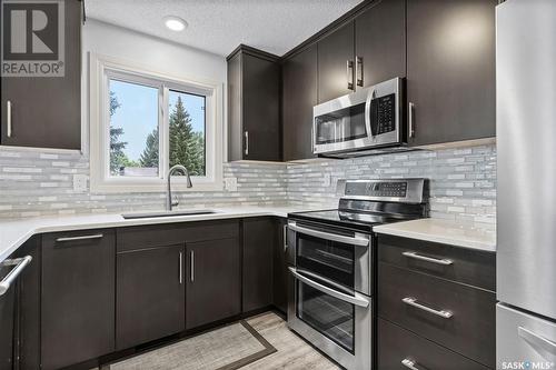 102 Adilman Drive, Saskatoon, SK - Indoor Photo Showing Kitchen With Upgraded Kitchen