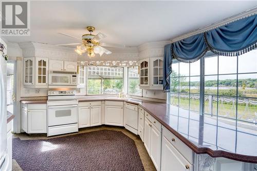 With plenty of counter + cupboard space ... - 1215 Narrows Lock Road, Portland, ON - Indoor Photo Showing Kitchen With Double Sink