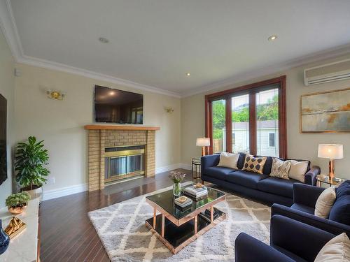 Salle familiale - 3130 Ch. Des Prairies, Brossard, QC - Indoor Photo Showing Living Room With Fireplace