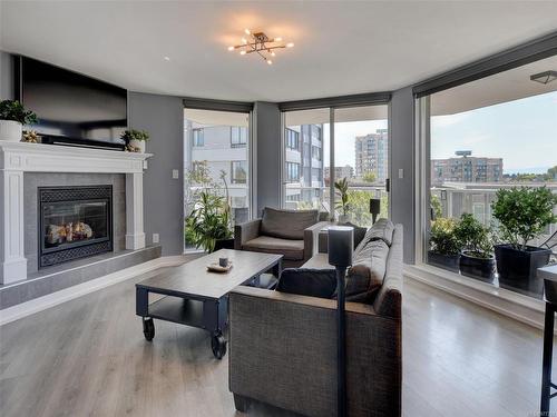 303-1015 Pandora Ave, Victoria, BC - Indoor Photo Showing Living Room With Fireplace