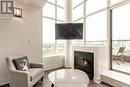 827 - 250 Manitoba Street, Toronto, ON  - Indoor Photo Showing Living Room With Fireplace 