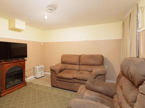 Salle familiale - 735 7E Avenue, Montréal (Lachine), QC - Indoor Photo Showing Living Room With Fireplace