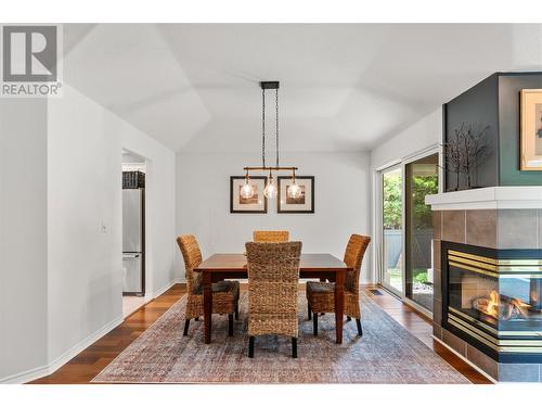 4222 Gallaghers Crescent, Kelowna, BC - Indoor Photo Showing Dining Room With Fireplace