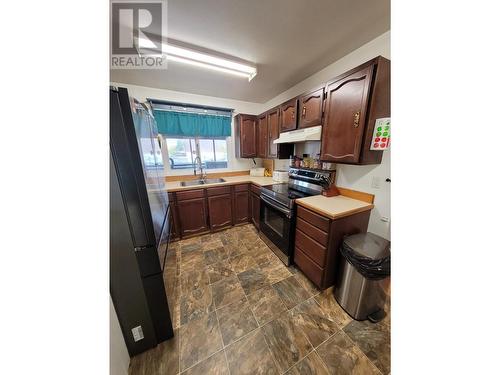 5347 Willow Road, Fort Nelson, BC - Indoor Photo Showing Kitchen With Double Sink