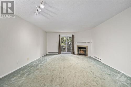 156 Rushford Private, Ottawa, ON - Indoor With Fireplace