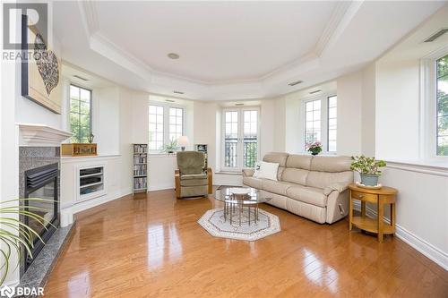 200 Collier Street Unit# 401, Barrie, ON - Indoor Photo Showing Living Room With Fireplace