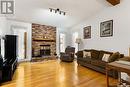 2806 Staples Bay E, Regina, SK  - Indoor Photo Showing Living Room With Fireplace 