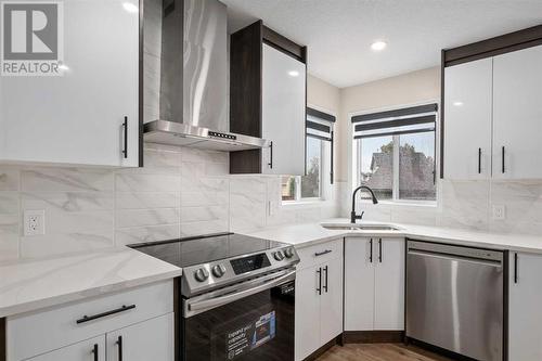 135 Mt Apex Crescent Se, Calgary, AB - Indoor Photo Showing Kitchen With Double Sink With Upgraded Kitchen