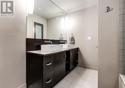 Double vanity ensuite bathroom with a huge shower - 