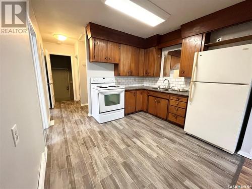 A And B 1001 110Th Street, North Battleford, SK - Indoor Photo Showing Kitchen With Double Sink