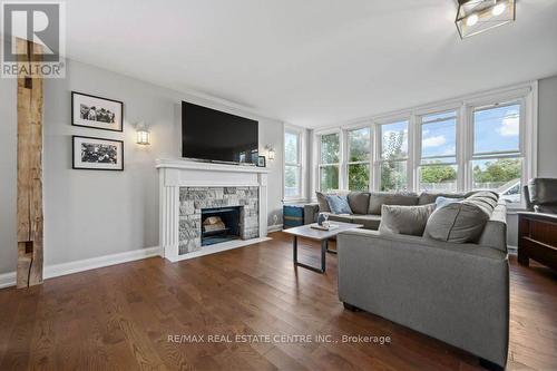 255 Gowrie Street S, Centre Wellington, ON - Indoor Photo Showing Living Room With Fireplace