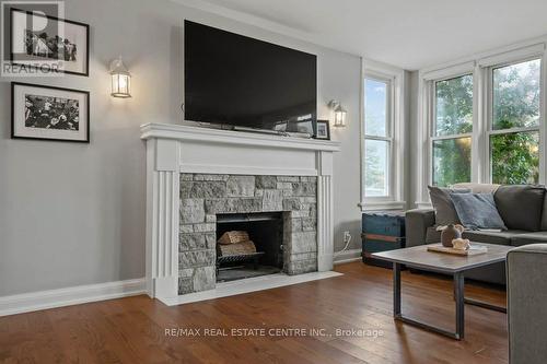 255 Gowrie Street S, Centre Wellington, ON - Indoor Photo Showing Living Room With Fireplace