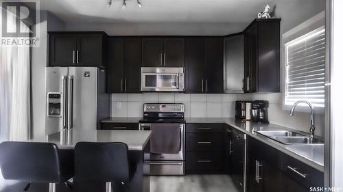 5316 Green Silverberry Drive E, Regina, SK - Indoor Photo Showing Kitchen With Double Sink With Upgraded Kitchen