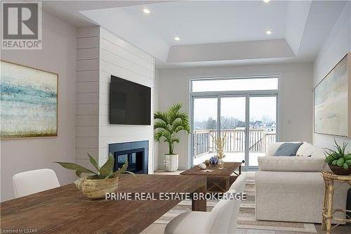 51 - 10 Coastal Crescent, Lambton Shores (Grand Bend), ON - Indoor Photo Showing Living Room With Fireplace