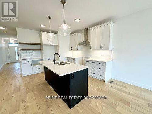 51 - 10 Coastal Crescent, Lambton Shores (Grand Bend), ON - Indoor Photo Showing Kitchen With Double Sink