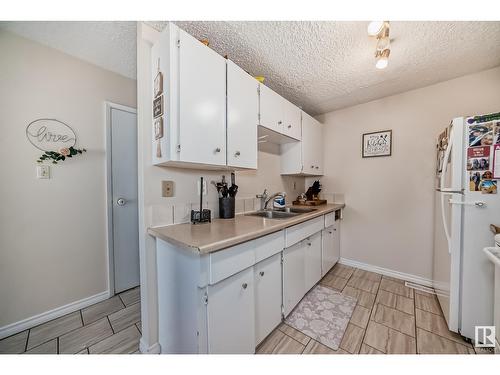 9E Clareview Vg Nw, Edmonton, AB - Indoor Photo Showing Kitchen With Double Sink