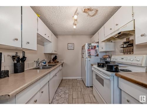 9E Clareview Vg Nw, Edmonton, AB - Indoor Photo Showing Kitchen With Double Sink