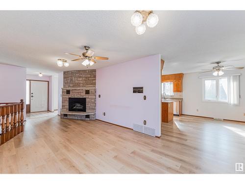 2308 113 St Nw, Edmonton, AB - Indoor Photo Showing Living Room With Fireplace