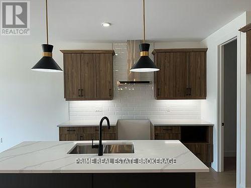 49 - 14 Coastal Crescent, Lambton Shores (Grand Bend), ON - Indoor Photo Showing Kitchen With Double Sink