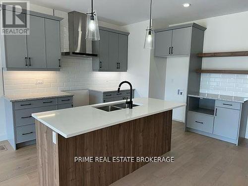 50 - 12 Coastal Crescent, Lambton Shores (Grand Bend), ON - Indoor Photo Showing Kitchen With Double Sink With Upgraded Kitchen