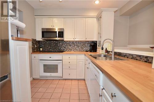 1564 Kerns Road Unit# 1, Burlington, ON - Indoor Photo Showing Kitchen With Double Sink