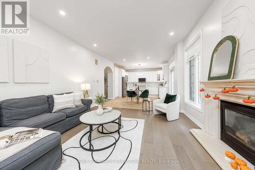 27 Couture Gardens, Vaughan, ON - Indoor Photo Showing Living Room With Fireplace