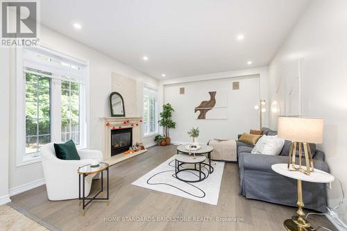 27 Couture Gardens, Vaughan, ON - Indoor Photo Showing Living Room With Fireplace