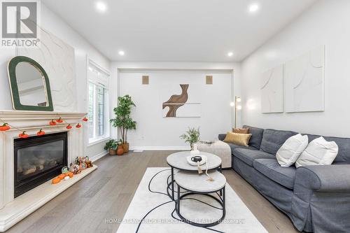 27 Couture Gardens, Vaughan, ON - Indoor Photo Showing Living Room With Fireplace