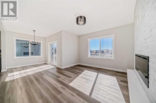 336 Beltmont Park Sw, Calgary, AB - Indoor Photo Showing Other Room With Fireplace