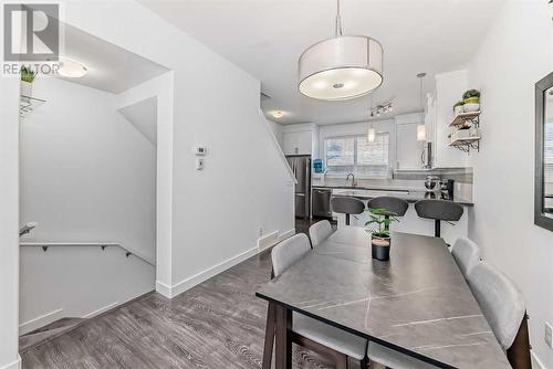 Open Concept Kitchen, Dining, and Living Area - 109 Evanston Manor Nw, Calgary, AB - Indoor Photo Showing Dining Room