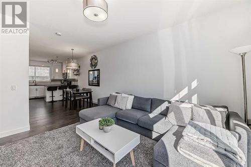 Open Concept Kitchen, Dining, and Living Area - 109 Evanston Manor Nw, Calgary, AB - Indoor Photo Showing Living Room