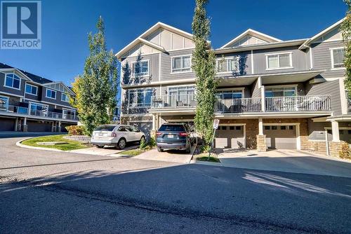 Single attached garage with driveway - 109 Evanston Manor Nw, Calgary, AB - Outdoor With Balcony With Facade