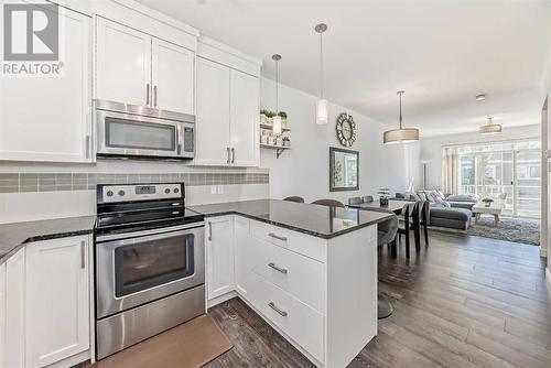 Bright white kitchen - 109 Evanston Manor Nw, Calgary, AB - Indoor Photo Showing Kitchen With Upgraded Kitchen