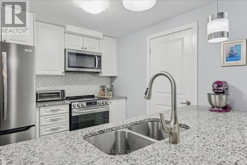 105 - 2388 Khalsa Gate, Oakville, ON - Indoor Photo Showing Kitchen With Stainless Steel Kitchen With Double Sink With Upgraded Kitchen