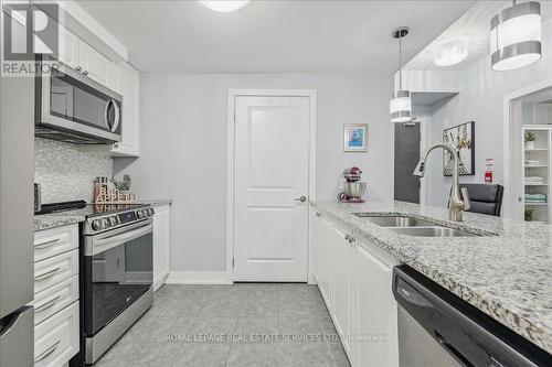 105 - 2388 Khalsa Gate, Oakville, ON - Indoor Photo Showing Kitchen With Stainless Steel Kitchen With Double Sink With Upgraded Kitchen