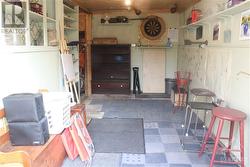 Entertaining in the back yard with the doors open to a area to play darts - 