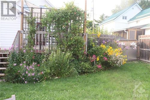 landscaped yard with a custom made gate. - 92 Herriott Street, Carleton Place, ON - Outdoor