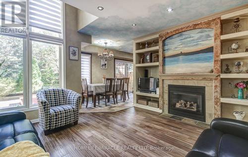 1699 Samuelson Circle, Mississauga, ON - Indoor Photo Showing Living Room With Fireplace